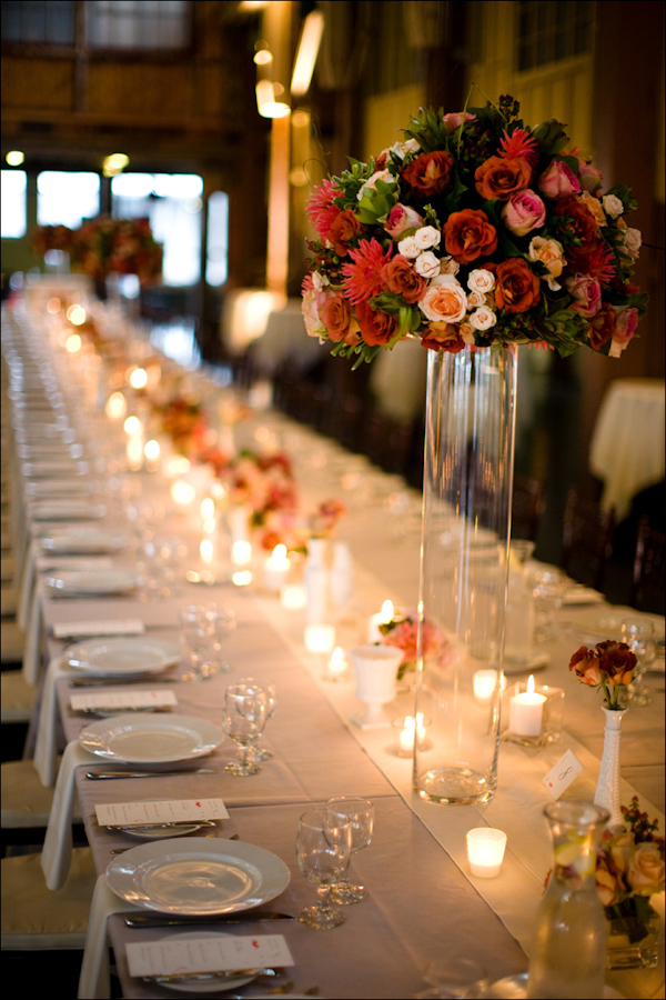 Romantic wedding reception seating arrangement with flowers and candles - Wedding Photo by Bradley Hanson